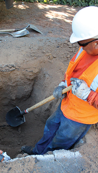 Digging dirt with shovel